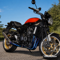 Kawasaki Z900RS clean titanium exhaust full motorcycle view outdoors