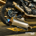 Triumph Scrambler 400 X clean slip-on exhaust showroom view