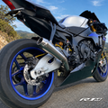 Yamaha YZF-R1M clean titanium exhaust installed rear view outdoors