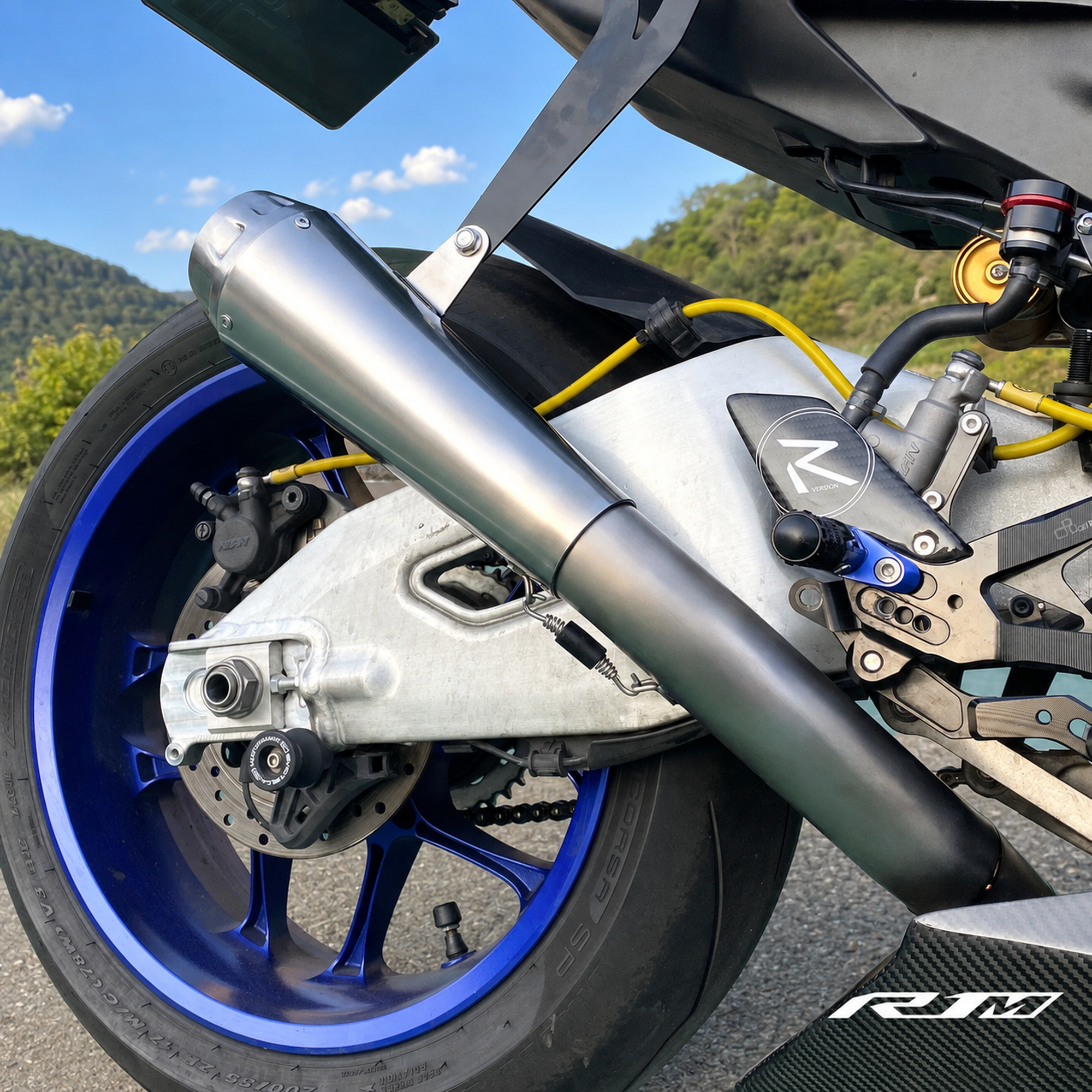 Yamaha YZF-R1M clean titanium muffler close-up outdoors